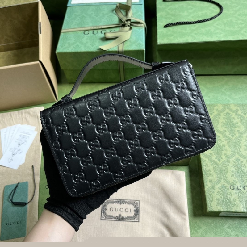G*u*i clutch bags